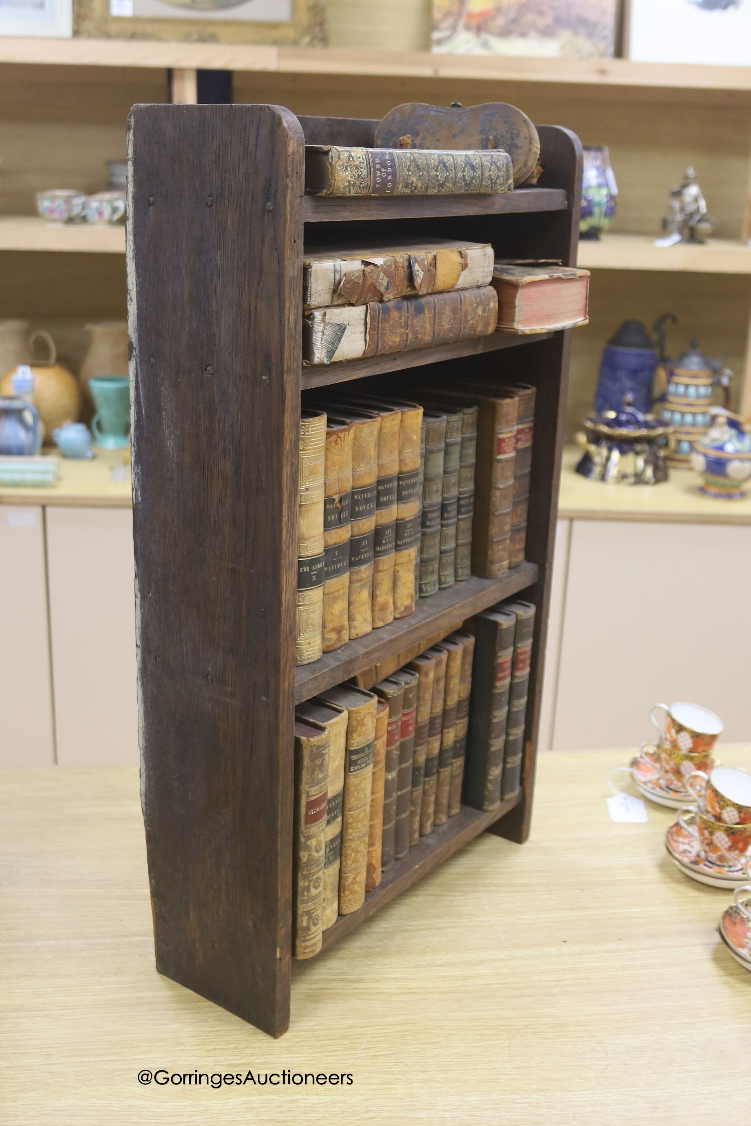 A group of 19th century leather bindings including Waverley Novels, Rob Roy, Tales of The Crusaders, etc., displayed in an oak bookcase, height 66cm